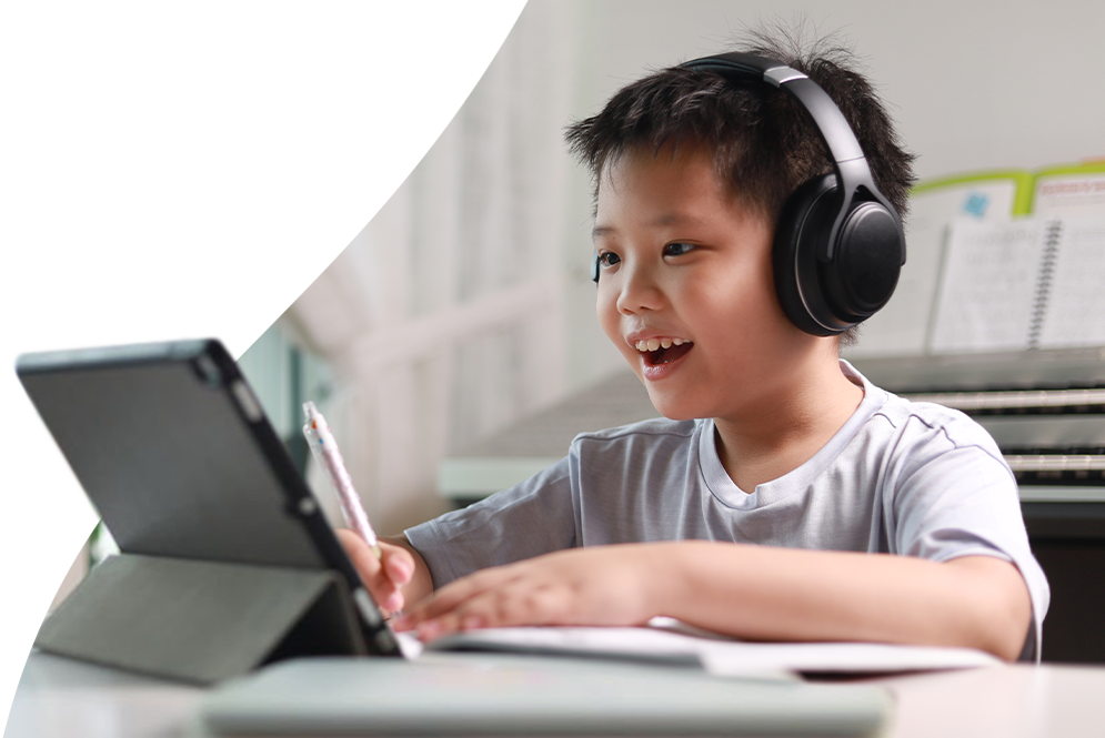 Elementary school student using a stylus and tablet